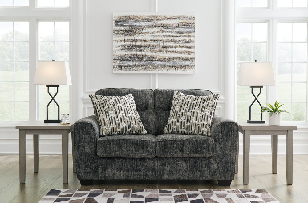 This loveseat speaks to those drawn to fresh, contemporary style with richly neutral appeal. Subtle and sophisticated, the plush upholstery and dark tri-block legs are a natural complement for so many color schemes. Two accent pillows make the seating eve