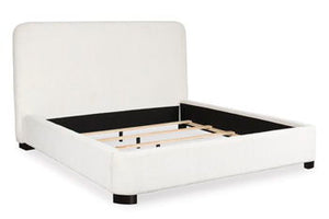 Casual, modern and inviting. Three words perfectly capture the essence of this king upholstered bed. Soft and easy to maintain, the Next-Gen Nuvellaâ„¢ performance fabric gracing the cushioned wing bed infuses a laid-back yet contemporary look and feel th