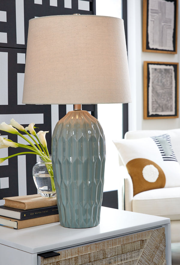  this table lamp is hard to miss. A dimensional design on the ceramic base shines a bright light on sophisticated style in the bedroom