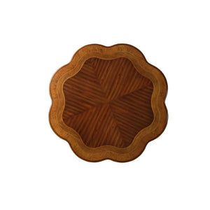 and is supported by a pedestal with oversized scrolled legs with antique hand-brushed finish