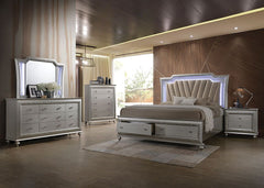 The Kaitlyn bed provides a commanding presence in any room. This contemporary storage bed features a channel tufted padded headboard and a low-profile footboard with storage drawers. Crafted with a glam look that is an ideal addition to any bedroom, the h