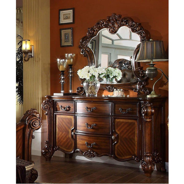 Create an elegant, traditional design in your bedroom with the cherry Vendome dresser. This hand-crafted piece inspired from the luxurious deigns of the past, this five-drawer, two-door dresser features elaborate wood carving details, traditional hardware