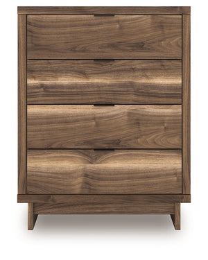  while the angular base incorporates contemporary motifs. Integrated drawer handles