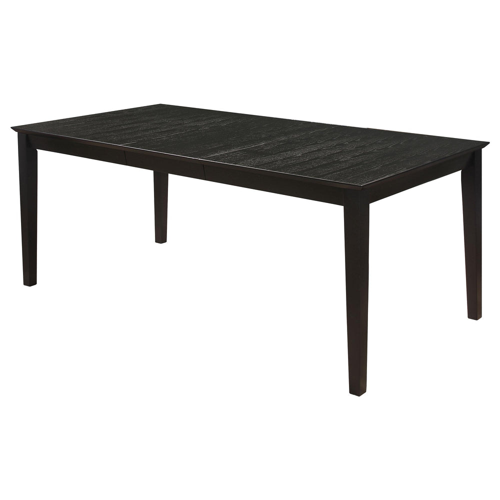 This five-piece dining set looks stunning with a variety of decor motifs. Crafted of solid hardwood and veneer, the elongated table and four side chairs boast an eye-catching distressed black finish. In a contrasting hue, the upholstered seat and back cus