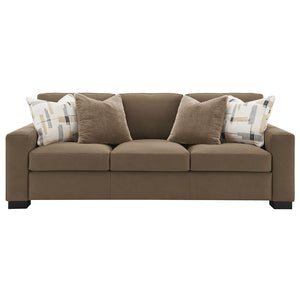  featuring plush pillows and wrapped in luxurious brown suede fabric. Its inviting design and soft