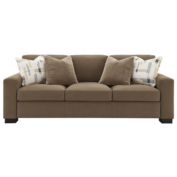  featuring plush pillows and wrapped in luxurious brown suede fabric. Its inviting design and soft