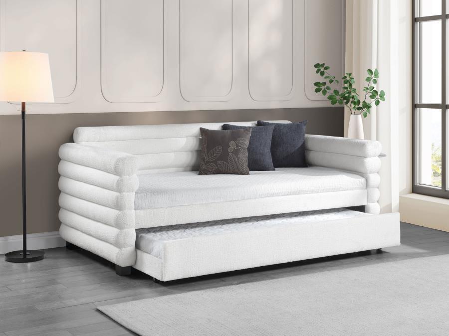 You-'re going to love the intriguing silhouette and boucle upholstery featured on this modern daybed and trundle. Offering contemporary flair, the daybed is designed with layered round bolsters, creating exceptional texture and dimensionality in your livi