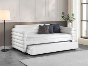  the daybed is designed with layered round bolsters