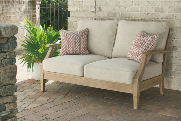  the loveseatâ€™s eucalyptus wood frame with tapered touches and slat styling is treate