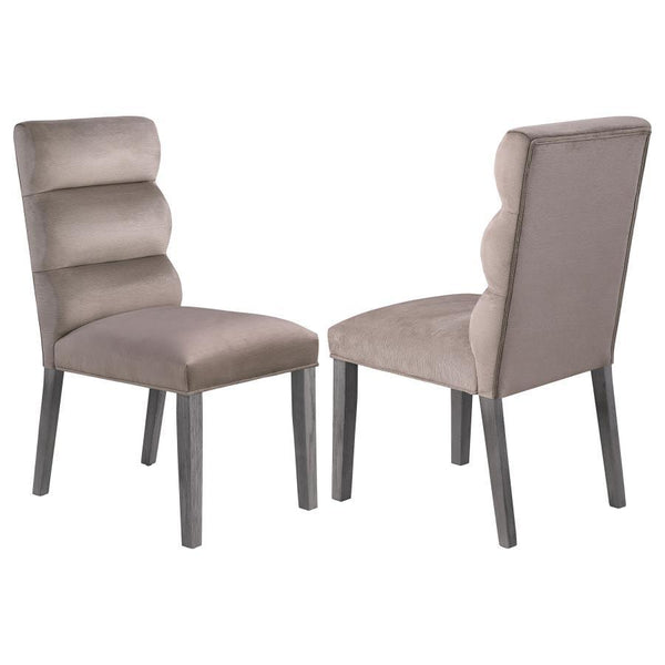 A pillowy look and feel brings ultimate comfort to a casual living space, targeting your kitchen or dining room with a light, floaty vibe, and adding a festive feel. This set of two side chairs checks all the boxes of design, comfort, and easy-living eleg