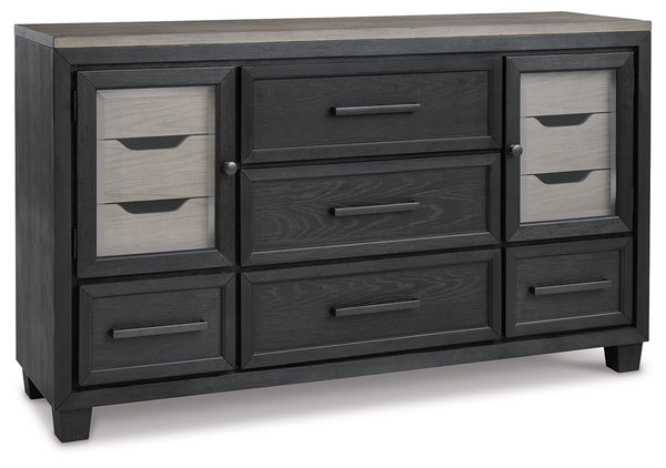This dresser is casual contemporary style simply done right. Its two-tone color scheme features a rich brushed black main color accented with a beautiful dusty grayish brown wood tone. With 11 soft-close drawers (three located neatly behind each door) thi