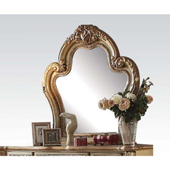 Create an elegant, classy design in your bedroom with the Dresden gold patina and bone mirror. This mirror features a beautiful scrolled frame with beveled edges. Add this mirror to any other piece from this collection to create the perfect bedroom.<br/><