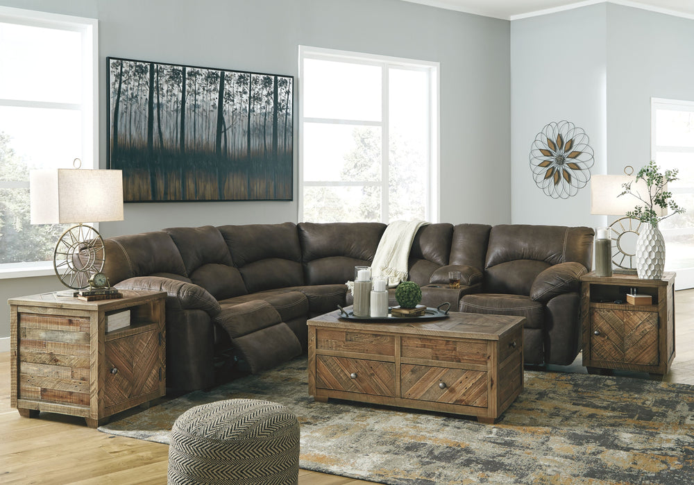 With plush cushions and wraparound pillow top arms, this sectional takes comfort to a whole new level. Faux vintage leather requires minimal care, making this relaxation station ideal in homes with children and pets. Reclining feature engages with the pul