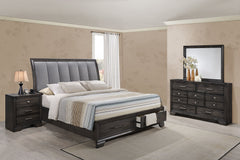 This bedroom set offers a sleek and stylish update to any space, featuring a rich, dark finish that commands attention while maintaining a sense of warmth and coziness. The bed stands as the stunning centerpiece, with its high, padded headboard upholstere