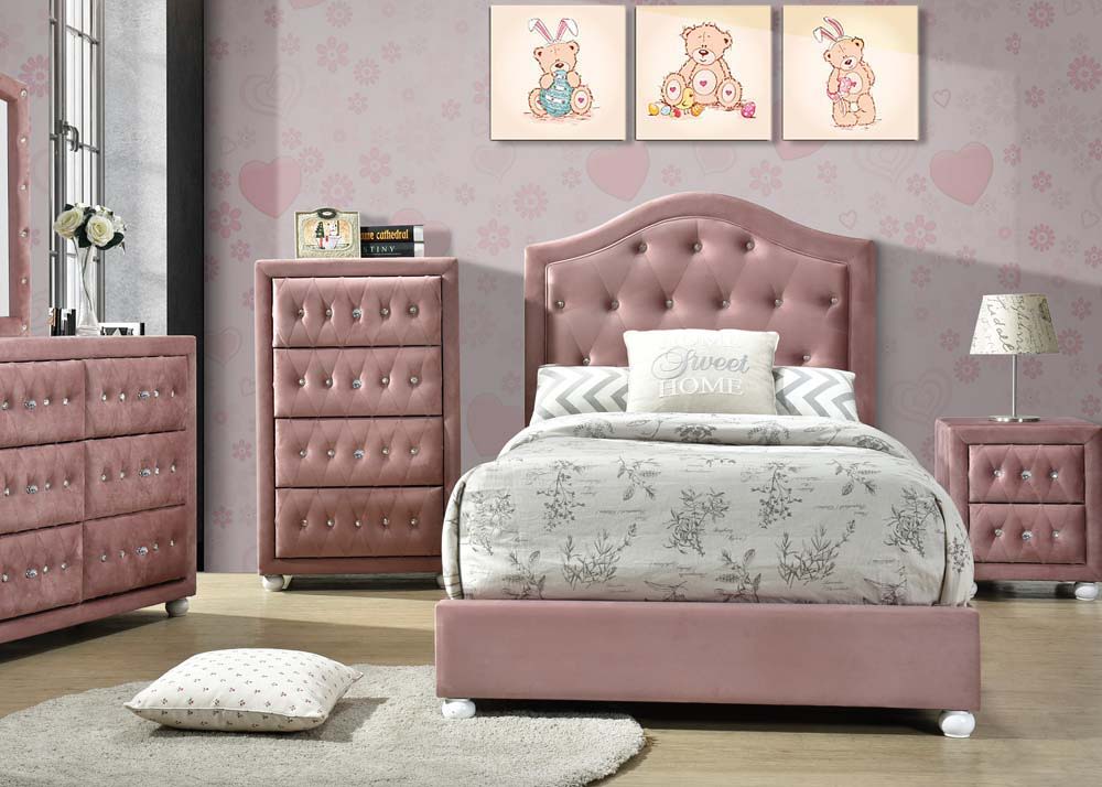 The Reggie youth bedroom set in pink fabric is full of character! Every piece in this glamorous collection features crystal-like button tuft details and cute wooden-bun legs in a crisp white finish. The panel bed features an arched headboard with a gentle