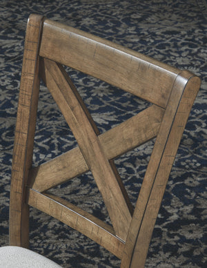  this upholstered dining chair with classic X back styling entices with warmth and earthy elegance