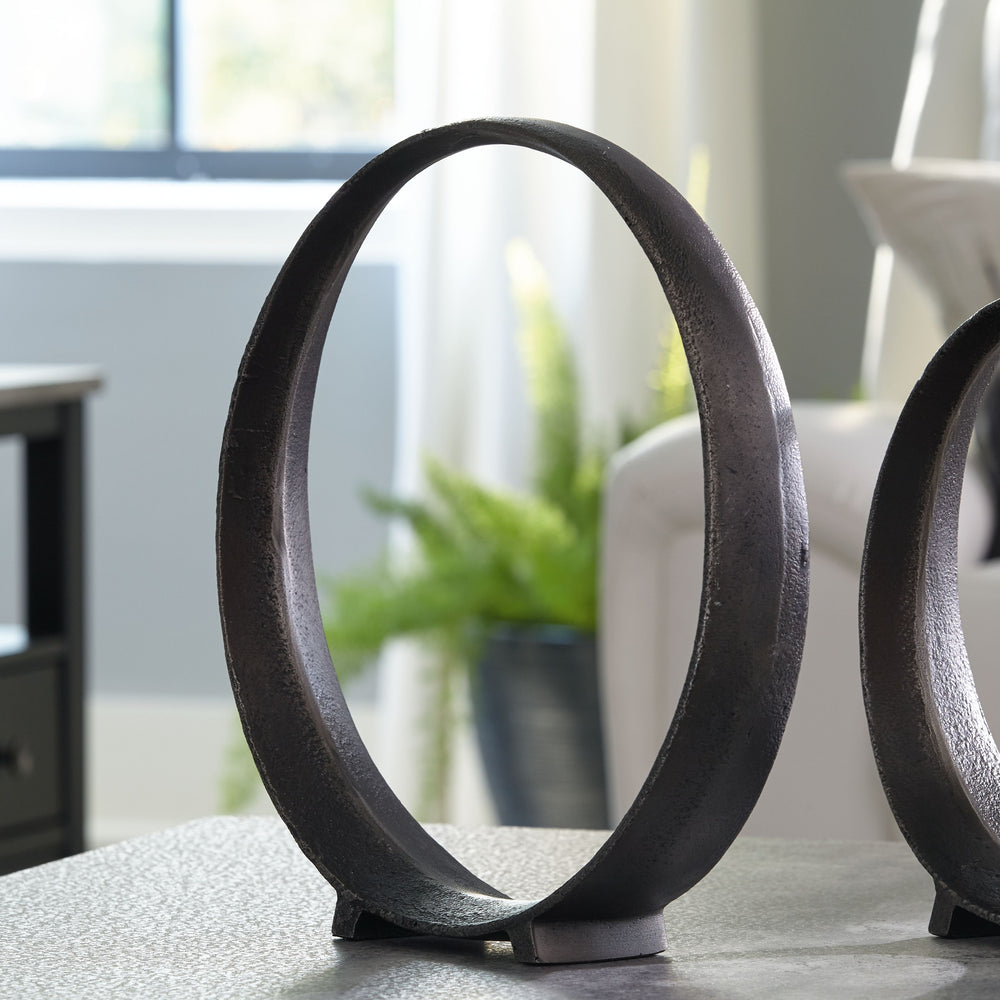 A modern take on classic geometric design, this sculpture rounds out your decor in sleek style. The black finish has an edgy appeal that remains versatile, suiting spaces from contemporary to casual.<br/><br/><b>Product Features</b><ul><li>Made with cast 