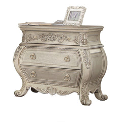 The Ragenardus nightstand is an impeccable example of truly memorable luxurious traditional design. This three-drawer antique white nightstand features a detailed French style front and English back in a stunning Bombay shape case, Felt-Lined top drawer, 