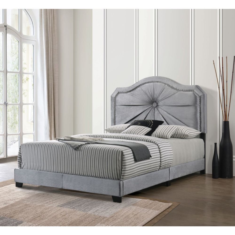The Frankie bed provides a commanding presence in any room. This contemporary panel bed features a fully padded arched headboard with low profile footboard in a luxurious gray fabric. The headboard is accented with Single Button Tufted & Nail-head Trim. T