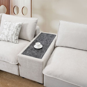 Marisa sectional sofa in luxurious beige boucle fabric is a perfect blend of style and comfort. With its plush pillows and spacious seating, it invites you to unwind in elegance. Ideal for any modern living room, this sectional offers a chic and cozy atmo