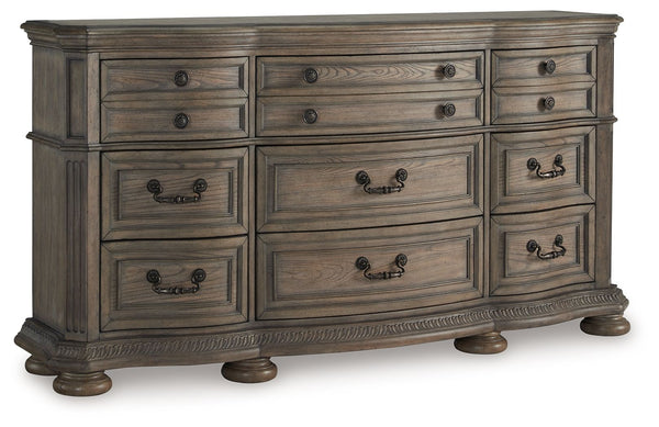 Merging traditional elegance with modern comfort, this dresser takes your bedroom retreat to the next level. Serpentine curves, ash swirl veneer inlays and a glazed antiqued-look finish radiate timeless sophistication. Drawers of various sizes are packed 