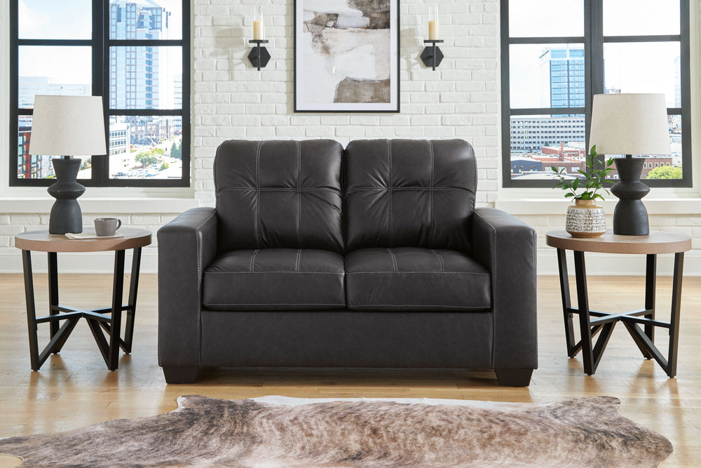 Everyday comfort meets versatile style in this loveseat. The handsome hue of the goes-with-anything faux leather takes away the stress of styling, expertly pairing with your existing aesthetic. From kicking back on the weekends to relaxing post-work, livi