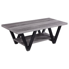 This contemporary coffee table enhances your living room with its bold, angular design and practical features. A rectangular grey wood-look top and lower shelf, crafted from engineered wood with a durable laminate veneer, provide stylish and functional su