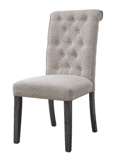 Beige linen upholstery fully covers its wooden frame for a light and airy feel. The side chair boasts a rolled back design with tufted button details, which embodies a timeless look with a classic flair. Wooden legs in a muted gray finish lend a bit of na