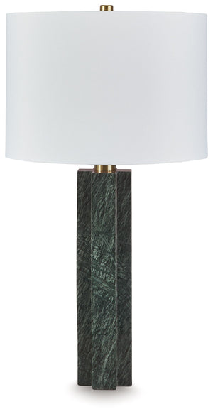 This table lamp is a master class in understated sophistication. Its sleekly dimensional base, crafted from rich green marble with subtle goldtone metal accents, adds a quietly exquisite touch to your favorite space. The statement-making lamp is a welcome
