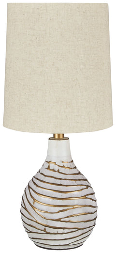 Shine a contemporary spotlight on your good taste with this table lamp. The antiqued white and goldtone finish of the metal lamp adds texture and interest to any space. With a modified drum shade, this light will illuminate your decor with style.<br><br><