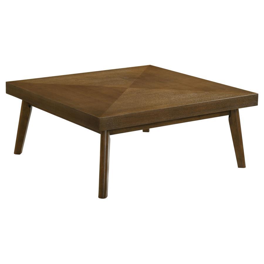 In the heart of the living space, this coffee table commands attention with its bold top and a walnut brown finish that captivates with its depth. The veneer parquet top is a celebration of craftsmanship, displaying a geometric dance of wood grains that c