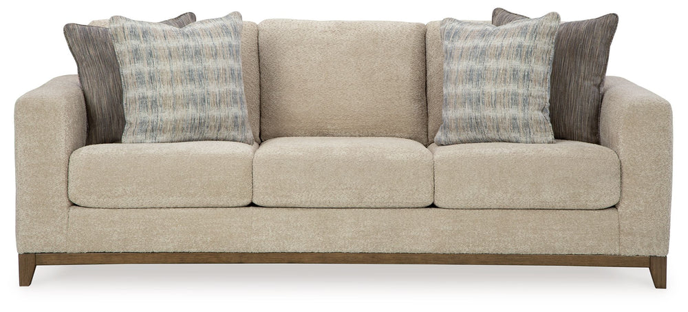 Serene style with a modern sensibility. Delight in the cozy, versatile embrace of this sofa. It takes an on-trend approach to irresistible texture and natural beauty, showcasing soft upholstery accented with a transitional wood trim. As refined as it is l