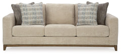 Serene style with a modern sensibility. Delight in the cozy, versatile embrace of this sofa. It takes an on-trend approach to irresistible texture and natural beauty, showcasing soft upholstery accented with a transitional wood trim. As refined as it is l