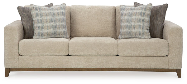 Serene style with a modern sensibility. Delight in the cozy, versatile embrace of this sofa. It takes an on-trend approach to irresistible texture and natural beauty, showcasing soft upholstery accented with a transitional wood trim. As refined as it is l