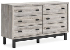 Craft a contemporary hideaway without breaking the bank. An elegant juxtaposition of refined neutral hues, this two-toned dresser brings sleek style to your space. Matte black drawer handles enhance the sheer simplicity of its profile. With this storage p