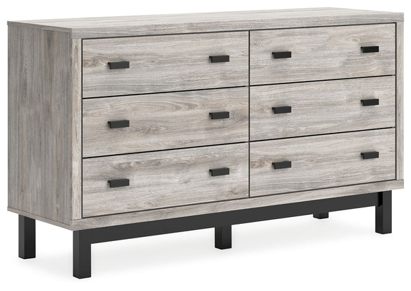 Craft a contemporary hideaway without breaking the bank. An elegant juxtaposition of refined neutral hues, this two-toned dresser brings sleek style to your space. Matte black drawer handles enhance the sheer simplicity of its profile. With this storage p