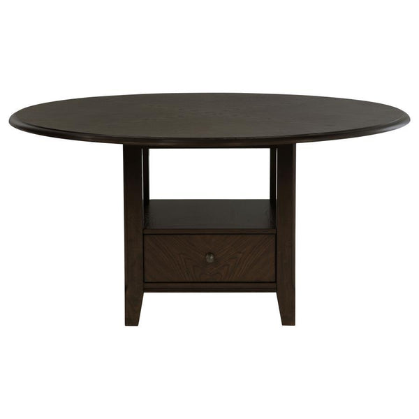  this table makes a striking centerpiece for any dining room. The pedestal base includes two drawers 