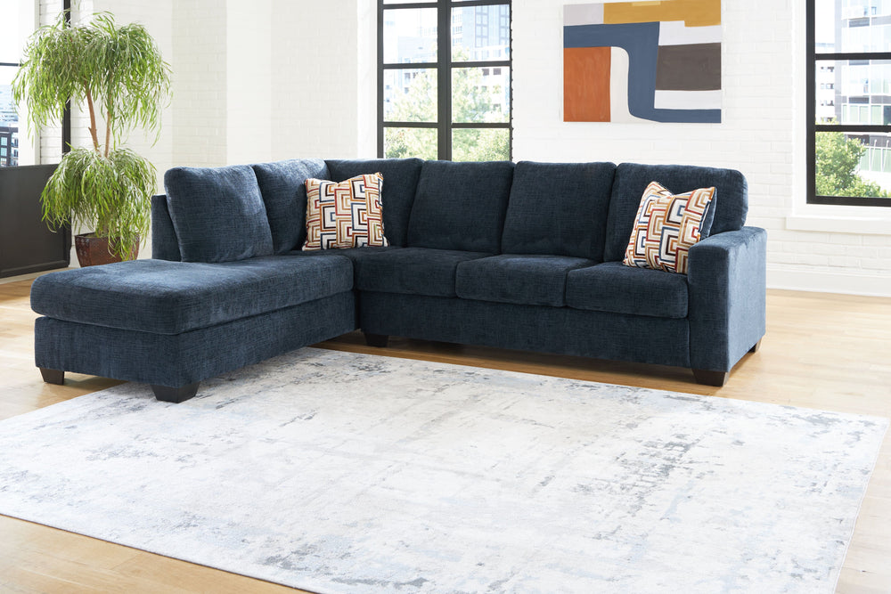Looking to make a bold statement with color? Liven up your living room with this sectional with chaise. Its trend-right navy blue upholstery adds a playful pop of color to your decor. Bold and eclectic accent pillows complete the look. Pairing posh style 