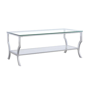  featuring a clear tempered glass top and lower shelf for practical storage. The curved legs and open design create an airy