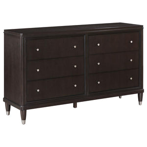 Introduce stylish storage in your bedroom with a modern six-drawer dresser. Its sleek look is accentuated in a dark brown finish, with metallic accents that add depth to tapering feel. Petite knobs decorate each drawer front as drawers offer ample storage