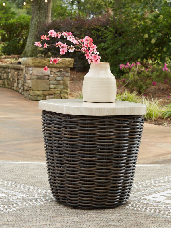  convenience and durability to alfresco fun. This outdoor end table captures the textural beauty of wicker while withstanding the elements