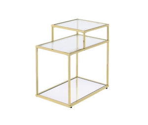 Modern simplicity makes your space feel uncluttered and stylish. The Uchenna Side Table has a brilliant color and lustrous finish to enhance it-'s sleek modern silhouette. Metal table frame in a gold finish exudes lustrous shine, topped with tempered glas