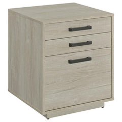 Free up desk space with this contemporary file cabinet, featuring a lovely whitewashed grey finish across its boxy frame and three drawers. Along each drawer is a slim gunmetal finished pull that presents an industrial modern flair to a transitional home 