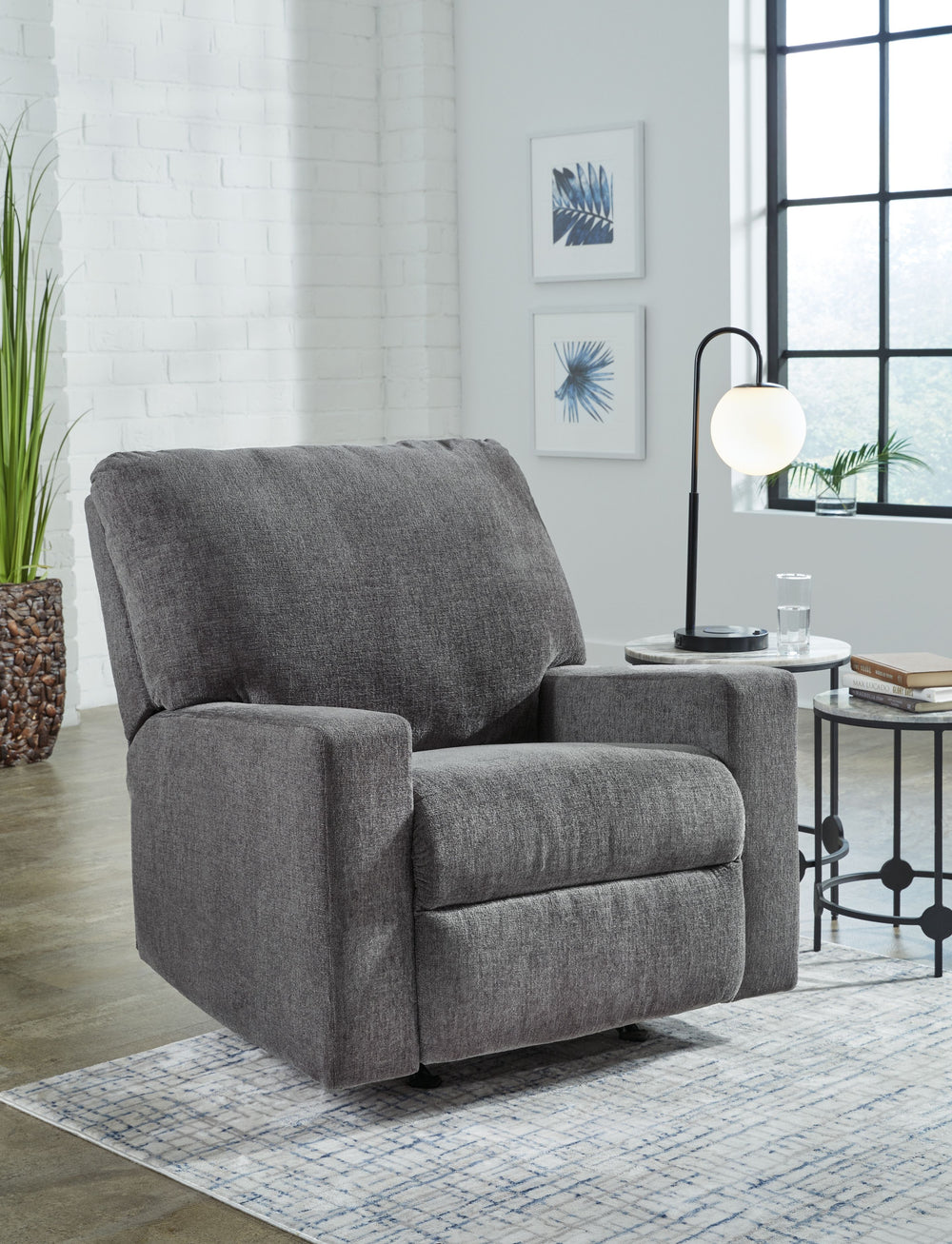Add functionality to your home without compromising on style. This budget-friendly recliner has a clean-lined, contemporary feel thatâ€™s handily complemented with seamless features for your relaxation. Well-suited to living rooms and multi-use spaces ali