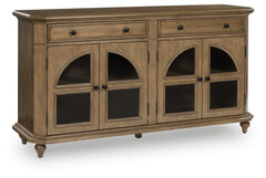 This lovely accent cabinet is a masterful blend of classic charm and practicality. A light brown finish and arched glass panel doors create a timeless look, while the spacious drawers and adjustable shelves offer versatile storage options. Convenient open