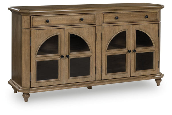 This lovely accent cabinet is a masterful blend of classic charm and practicality. A light brown finish and arched glass panel doors create a timeless look, while the spacious drawers and adjustable shelves offer versatile storage options. Convenient open