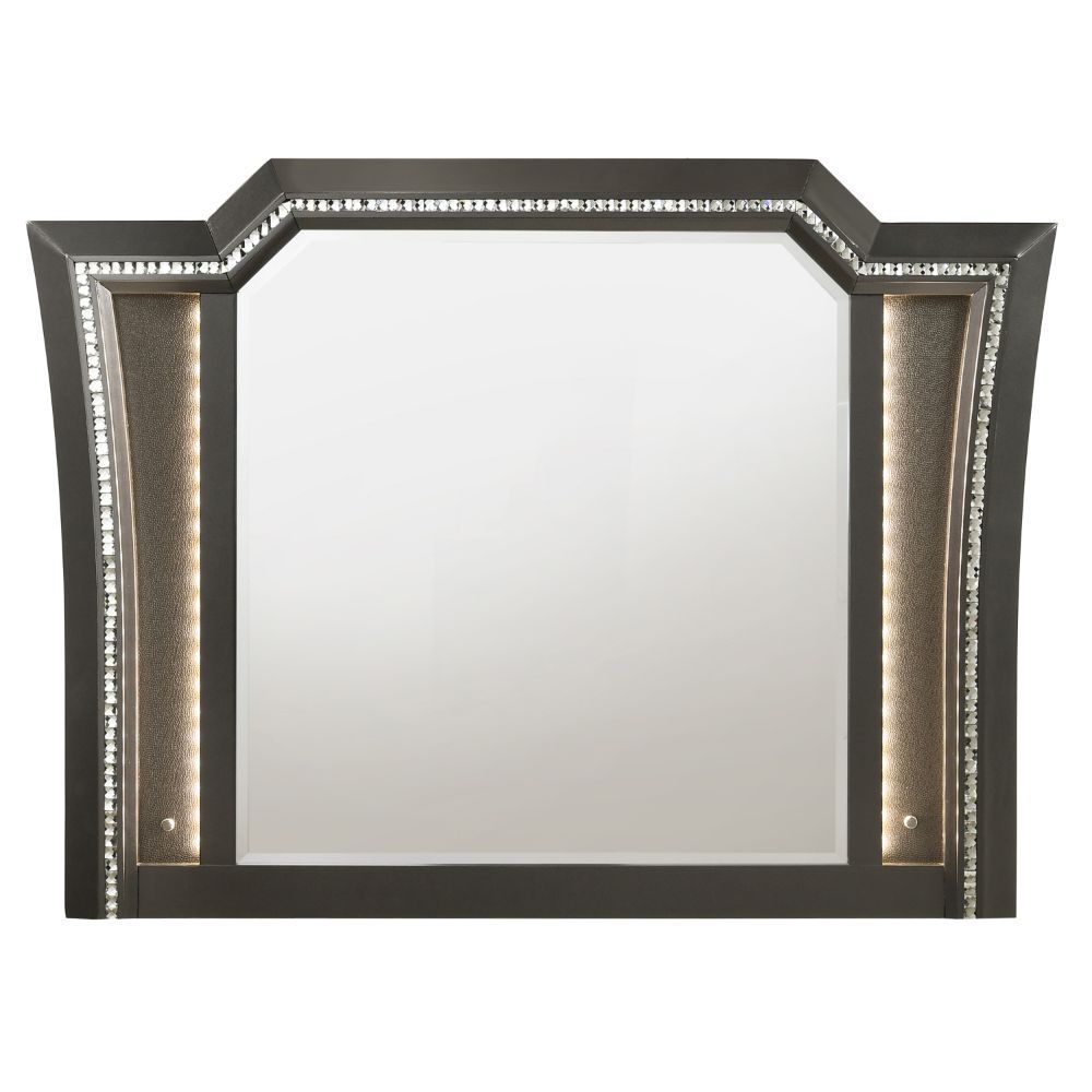 The Kaitlyn mirror provides a commanding presence in any room. Crafted with a transitional look that is an ideal addition to any bedroom, the mirror is accented with LED light and a crystal-like sparkling trim. Its crystal-like trimming creates dazzling g
