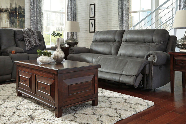  nailhead trim and a -"weather worn-" effect on the upholstery give this handsome set a buttoned-up appeal and fresh feel. Loveseat has center console with dual cup holde