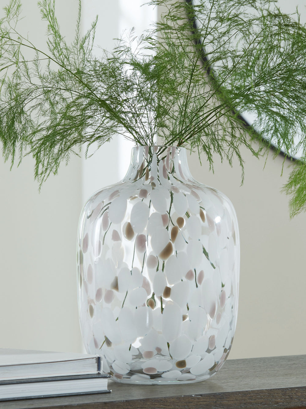 Be inspired by the artistry of blown glass. This beautifully crafted vase is a casual take on a classic silhouette, with versatile neutral hues that are right at home in settings from farmhouse to modern. Drop in the seasonâ€™s florals for on-trend appeal