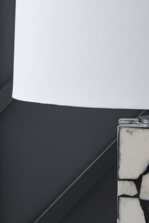  the lamp casts an elegant glow in the entryway or l